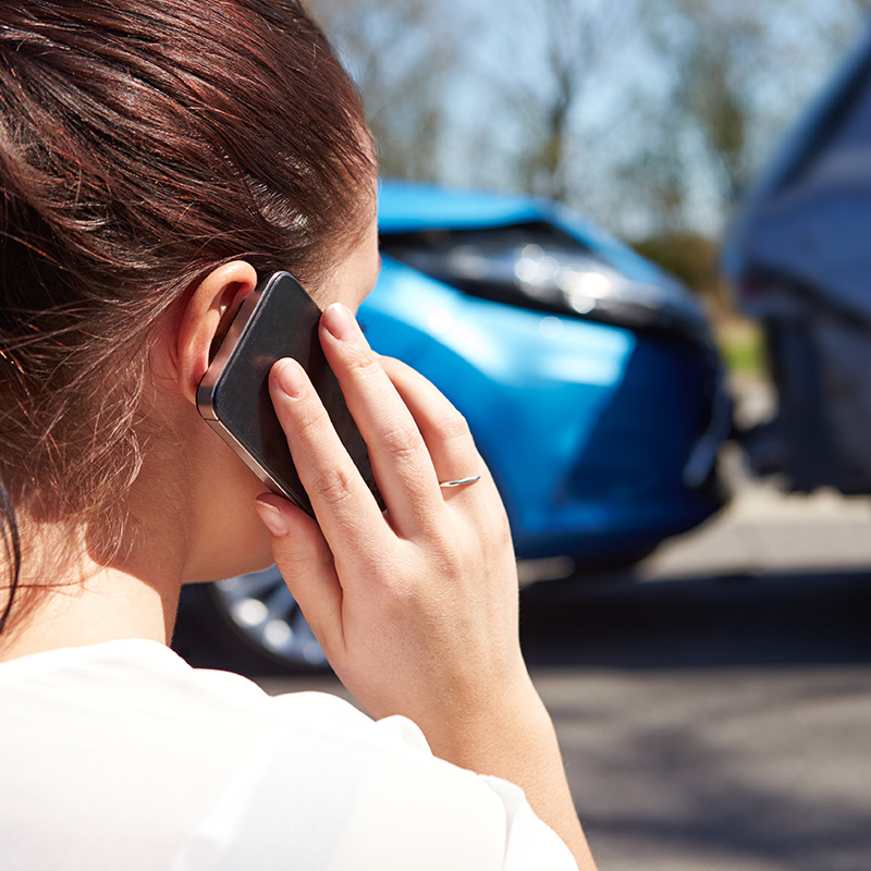 Woman on Phone After Car Accident